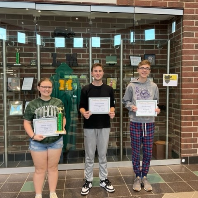 students smiling holding certificate